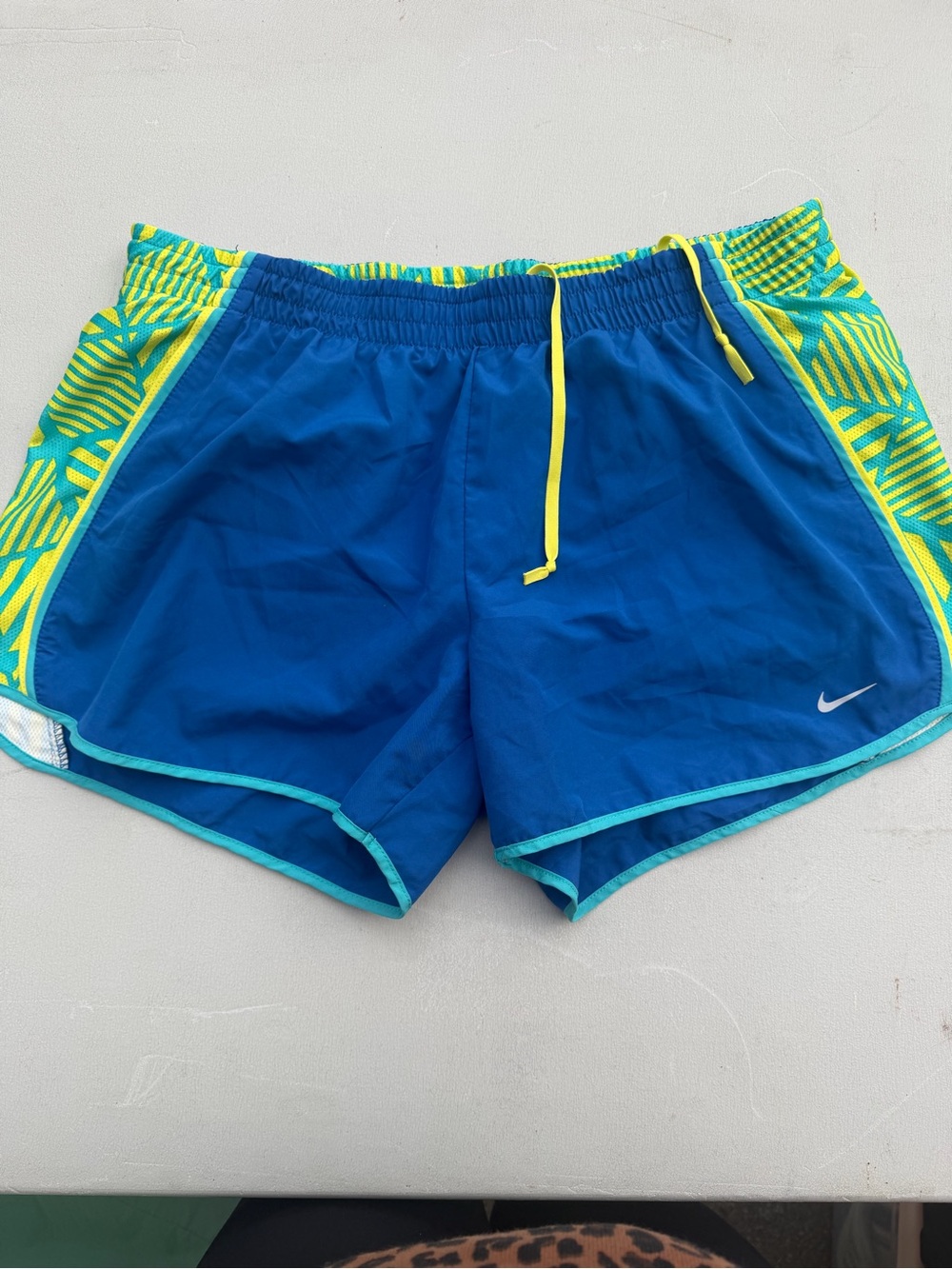 Nike Women’s Blue Athletic Shorts with Neon Yellow Accents